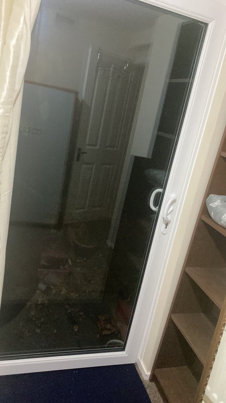 Photo 1: Sliding glass door opening in the garden patio