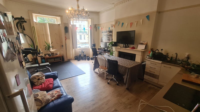 Photo 1: Cozy space at night but photos appear better with all the light