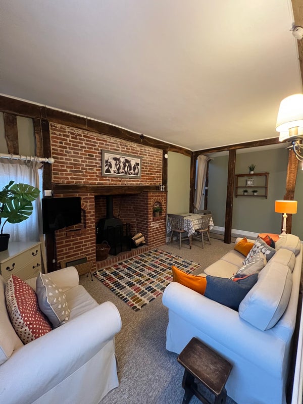 Photo 1: Sitting room with wood burner