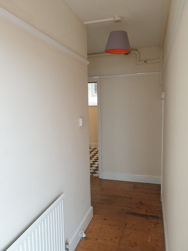 Photo 1: Corridor from front door (also an under the stairs cupboard for storage not pictured)