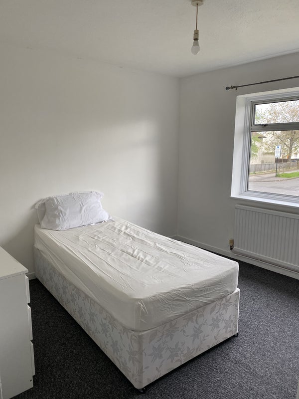 Photo 1: Large room facing toward main road 