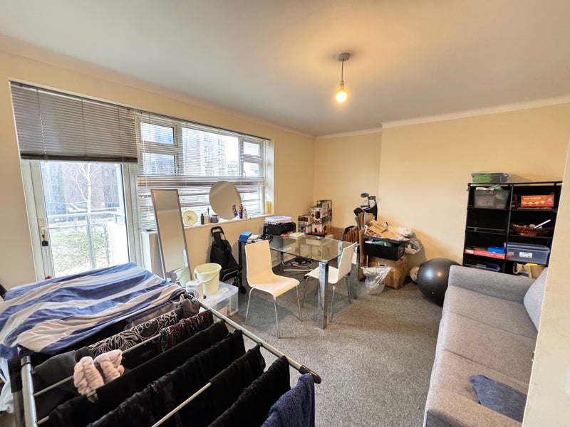 Photo 1: Living room (most of the stuff in the corner will be removed)