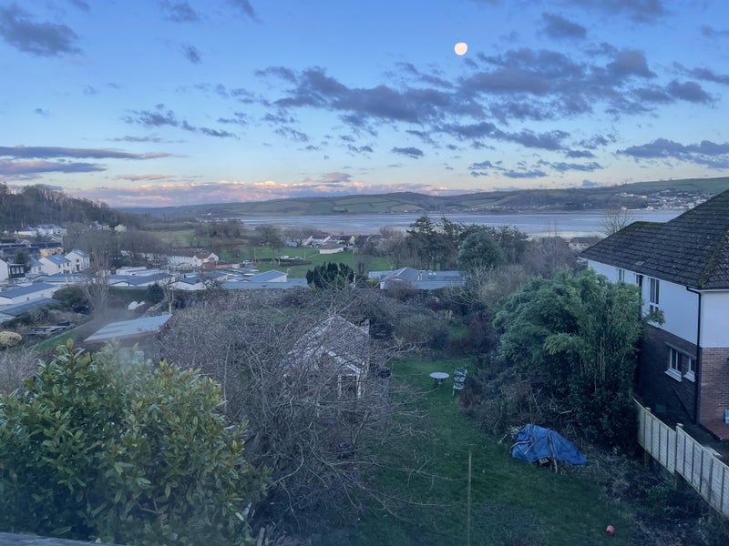 Photo 1: View of garden and estuary