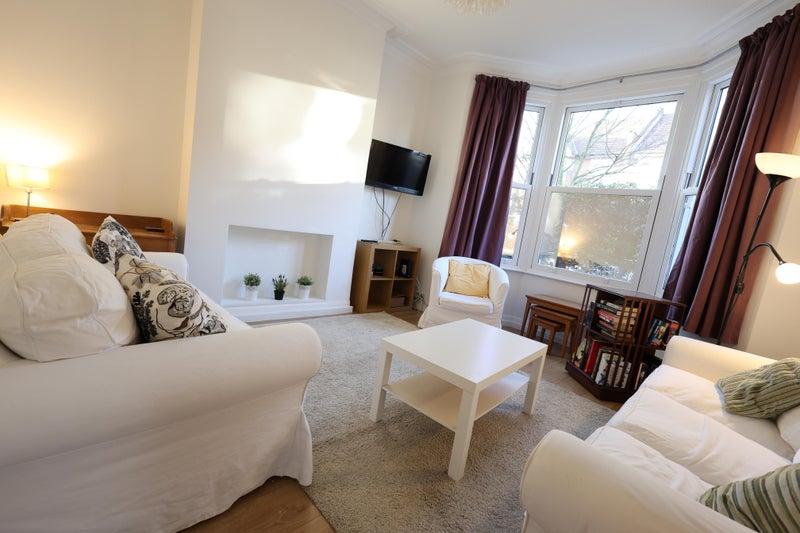 Photo 1: sitting room at front of house