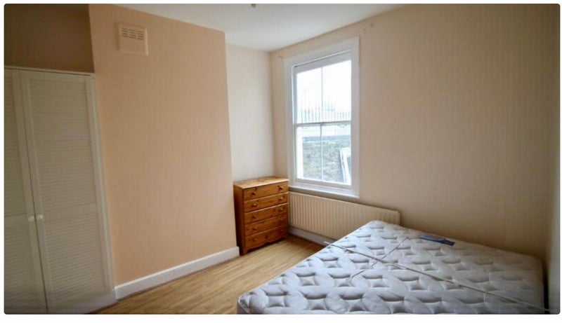 Photo 1: Room with built in wardrobe, chest of drawers and bed.