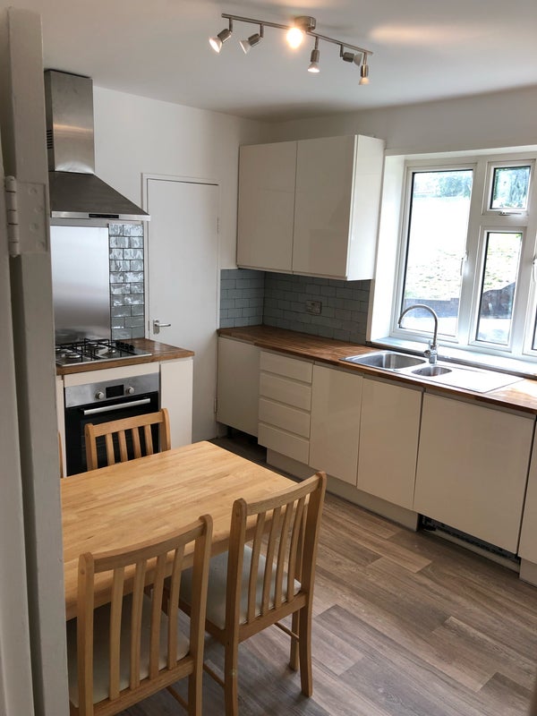 Photo 1: Kitchen with dishwasher , washing machine and tumble dryer