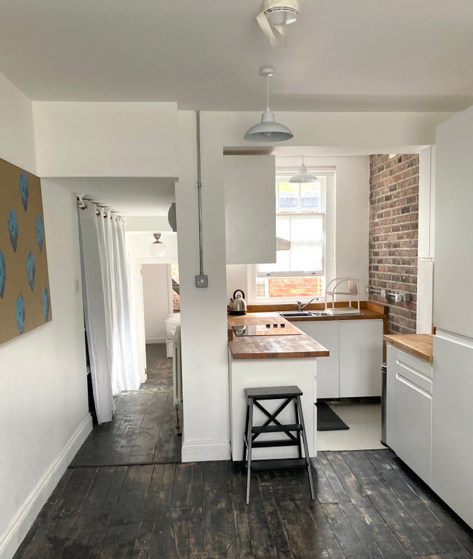 Photo 1: Kitchen and corridor to bedroom