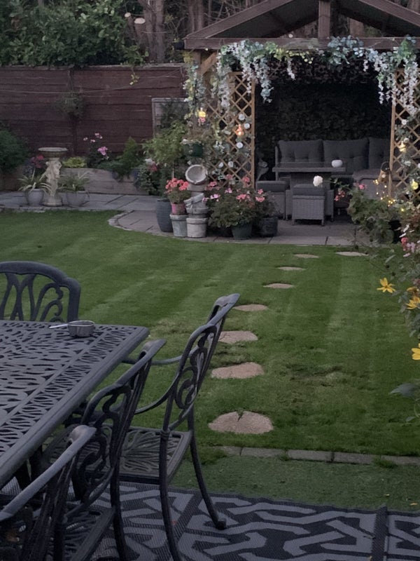 Photo 1: Garden and gazebo. 