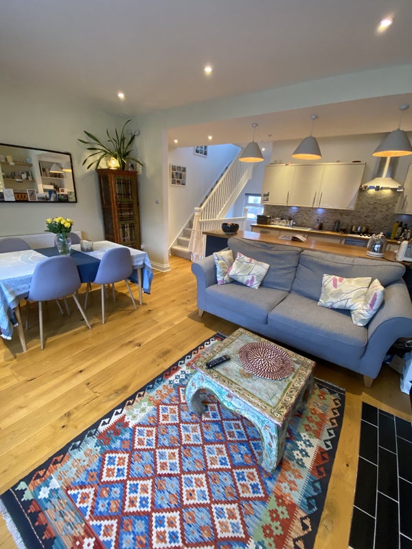 Photo 1: Living room view into kitchen