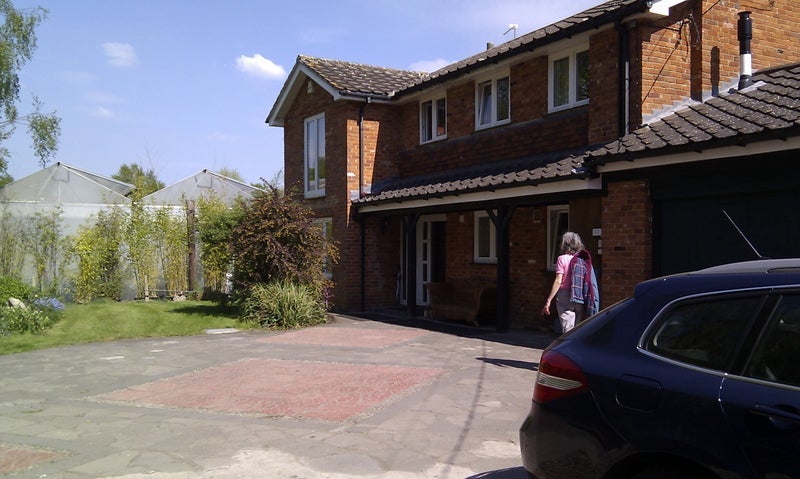 Photo 1: Front of house private parking