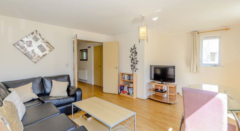 Photo 1: Comfy lounge with TV and dining space