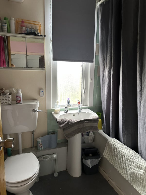 Photo 1: Shared bathroom, over bath shower 