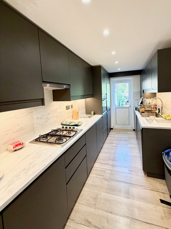 Photo 1: Brand new kitchen with washing machine and dishwasher.