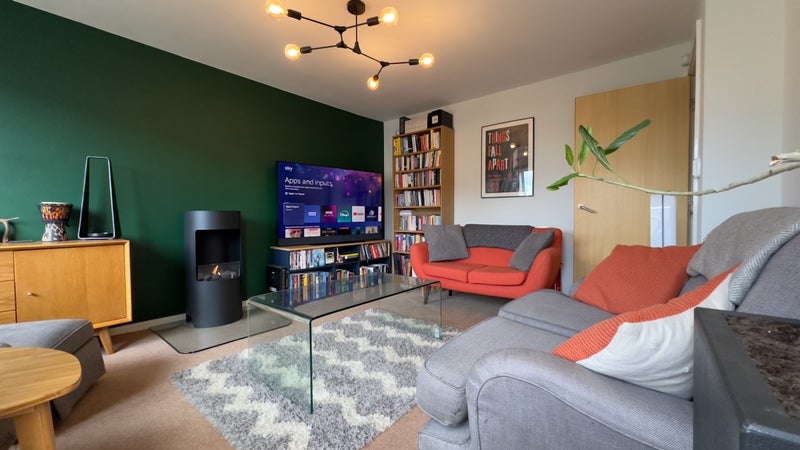 Photo 1: Shared Living Room with Real Fire and Sky Smart TV