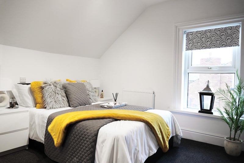 Photo 1: The bed is a storage bed so lots of additional space underneath