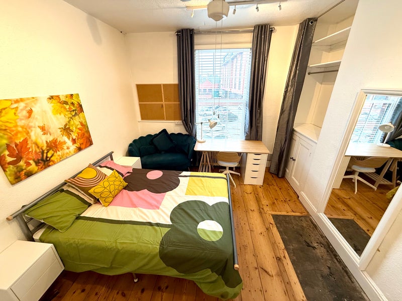 Photo 1: Room 4 very good size room with sofa & lots of storage! 