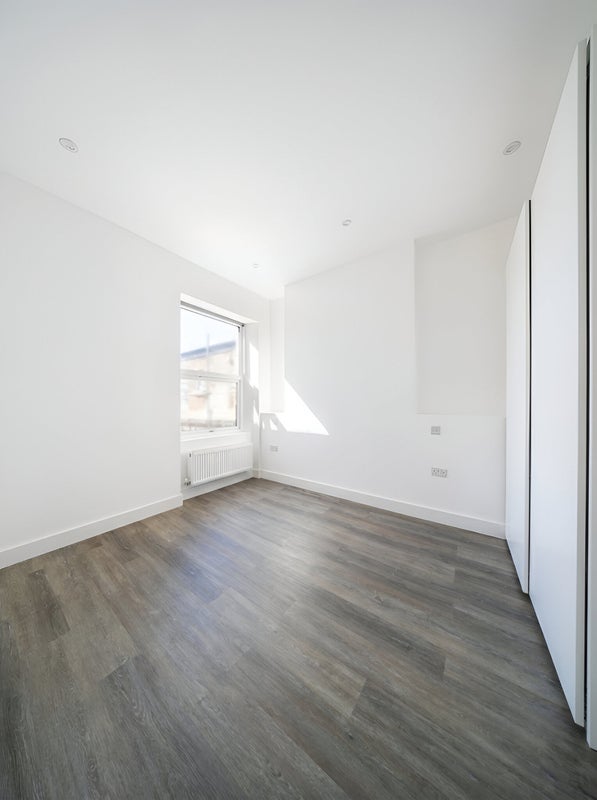 Photo 1: Room to let - fitted wardrobe on the right. Window overlooks rear of property.