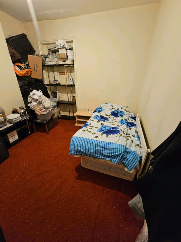 Photo 1: Will empty contents. Currently a storage room.