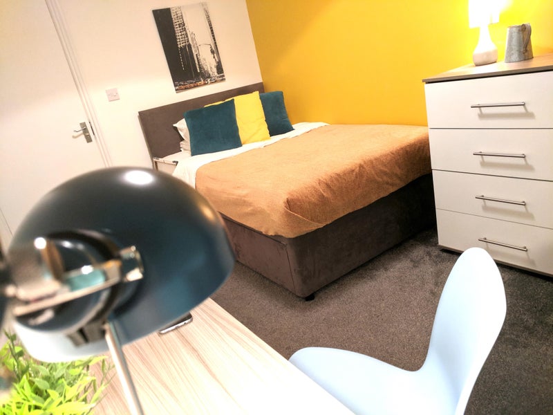 Photo 1: spacious double bed with extra storage underneath