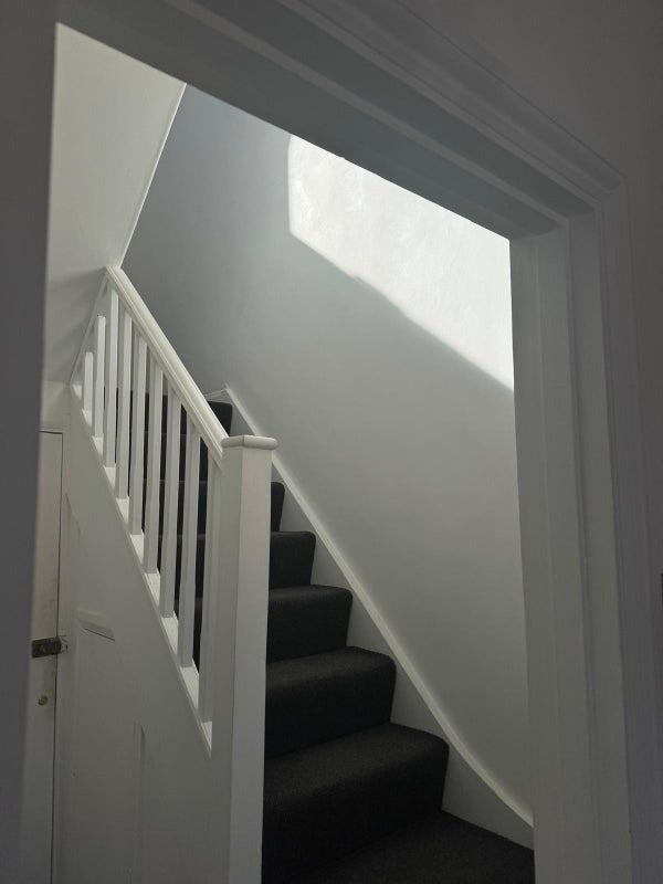 Photo 1: Stairs up to the bedrooms
