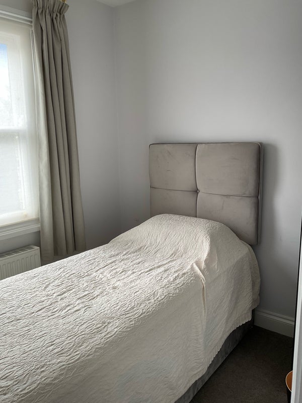 Photo 1: The bed has storage underneath