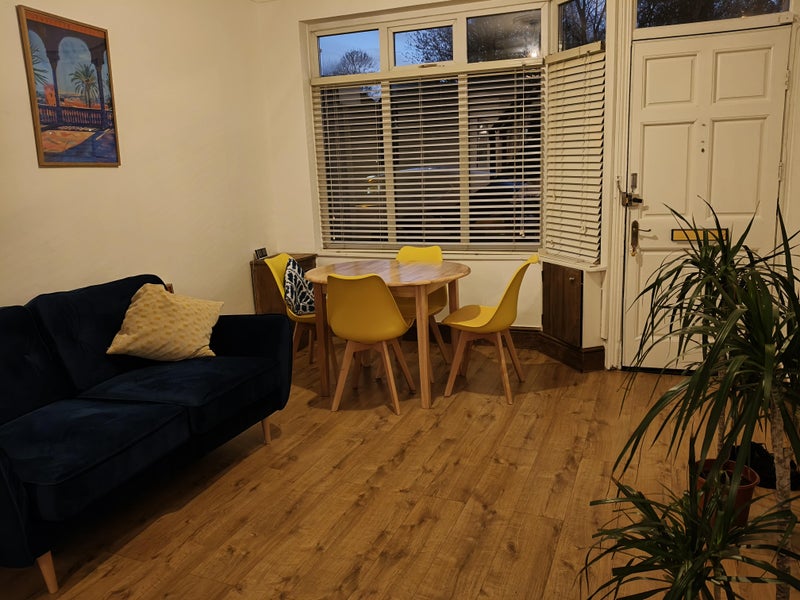 Photo 1: Front lounge area