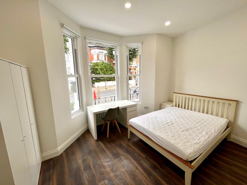 Photo 1: Large ensuite bedroom with high ceilings
