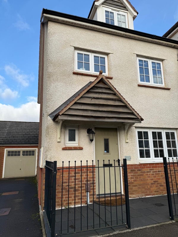 Photo 1: Front house with garage and drive