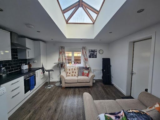 Photo 1: Living Area - Kitchen & Sofas