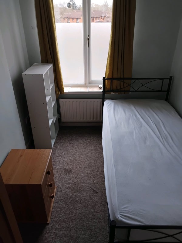 Photo 1: 30cm clearance storage space beneath bed. Currently privacy frost-effect covering on window.