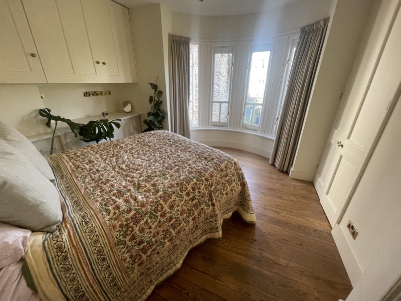 Photo 1: Bedroom with built-in cupboards and wardrobe