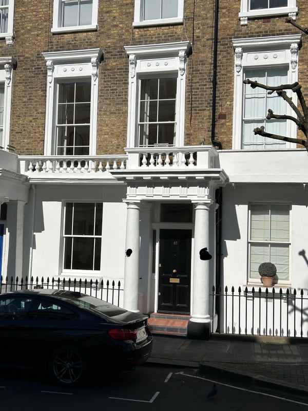 Photo 1: Front of house, redecorated in 2025