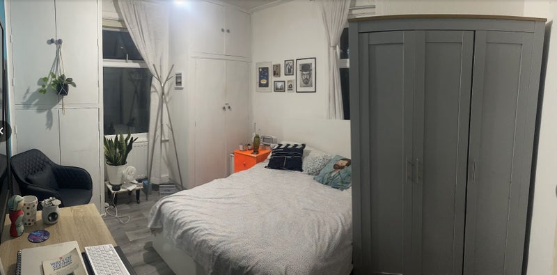 Photo 1: Bedroom - Only the bed, bedside table, and wardrobe are provided with the room.