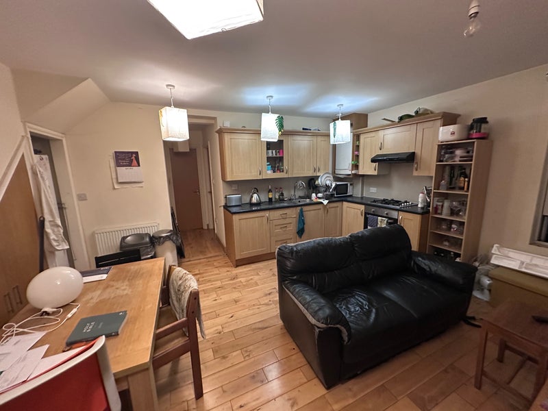 Photo 1: Shared living room & kitchen