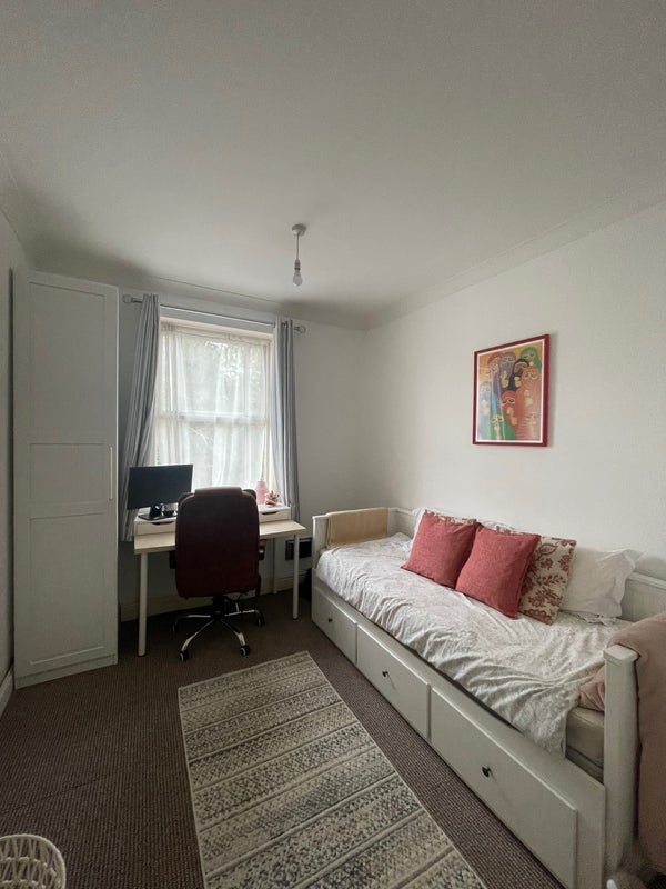 Photo 1: Bedroom with day bed that pulls out to be a double