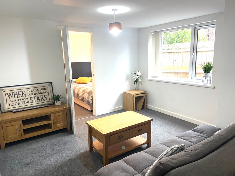 Photo 1: Private lounge with kitchenette, leading to double bedroom, with en suite