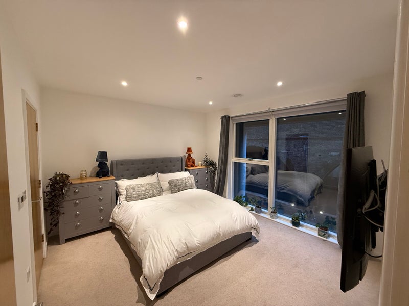 Photo 1: En-suite bedroom with king bed 