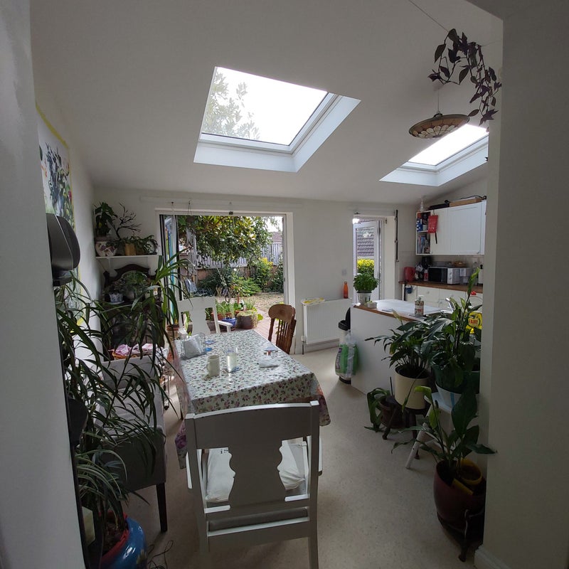 Photo 1: Bedroom is on ground floor, with the kitchen and dinning area with view of garden at the back