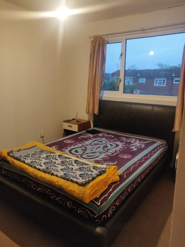 Photo 1: Double bedroom with large wardrobe and bedside table
