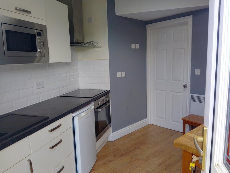 Photo 1: Entrance to Kitchen/Living room