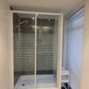 Photo 5: Private downstairs shower with storage