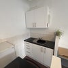 Photo 4: The sink and strage cupboards