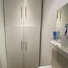 Photo 5: Downstairs Toilet and Storage Cupboard 