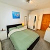 Photo 2: Bedroom with kind sized bed