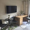 Photo 2: TV, Desk and Seating