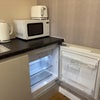 Photo 4: The kichenette / utilty is equiped with a fridge (with freezer compartment), microwave, air fryer an