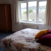Photo 7: The room overlooks a garden and  hills beyond