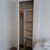 Photo 4: Storage cupboard with shelves and clothes rail
