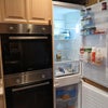Photo 3: Double oven and fridge freezer 
