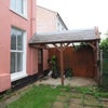 Photo 2: Carport by back door